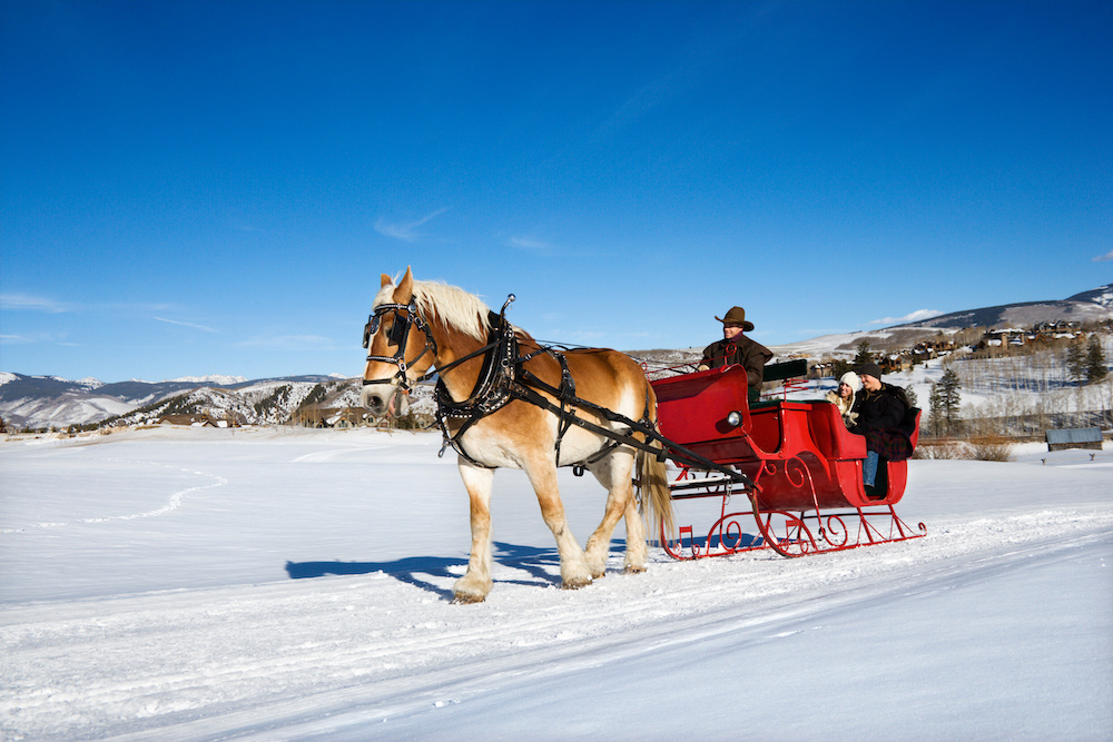 https://www.fourseasonssteamboat.com/wp-content/uploads/2023/12/couple_on_steamboat_sleigh_ride.jpeg?utm_source=chatgpt.com